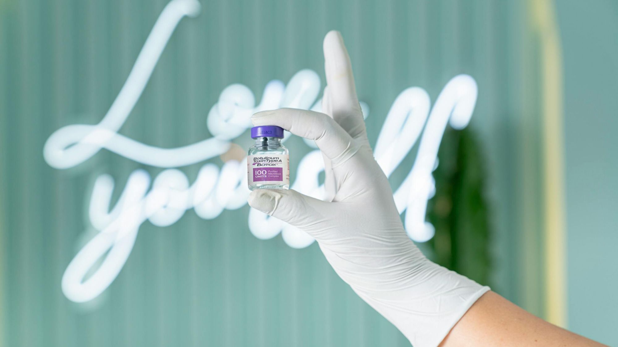 A nurse at Mirror by La Vita clinic holding a Botox injection unit for improved skin care